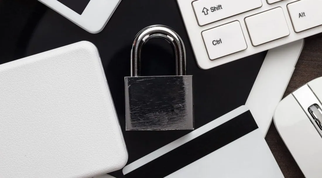 padlock between computer keyboard and wallet